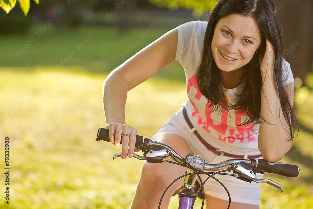 Fototapeta premium Young girl on a bicycle
