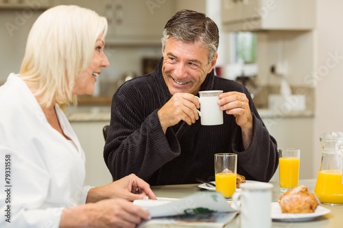 Mature couple having breakfast together