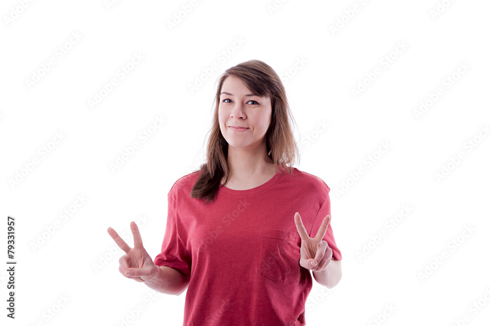Young woman showing two fingers, positive or peace gesture, on w Young woman showing two fingers, positive or peace gesture, on w