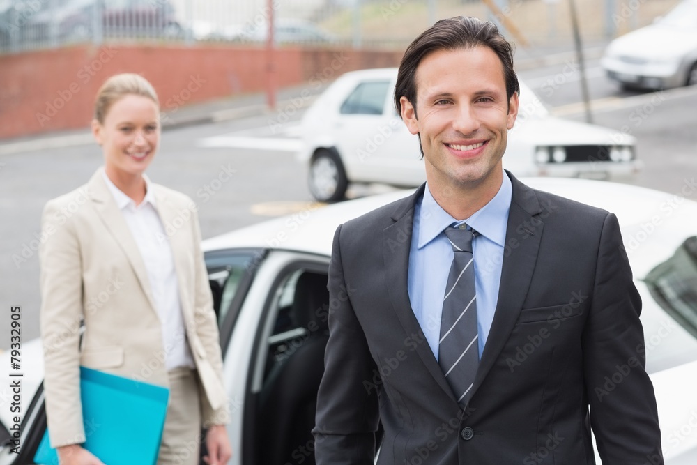 Team of businessman smiling at camera Team of businessman smiling at camera