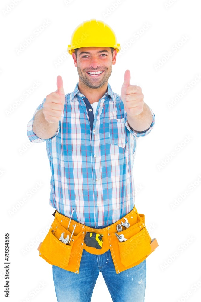 Happy repairman gesturing thumbs on white background