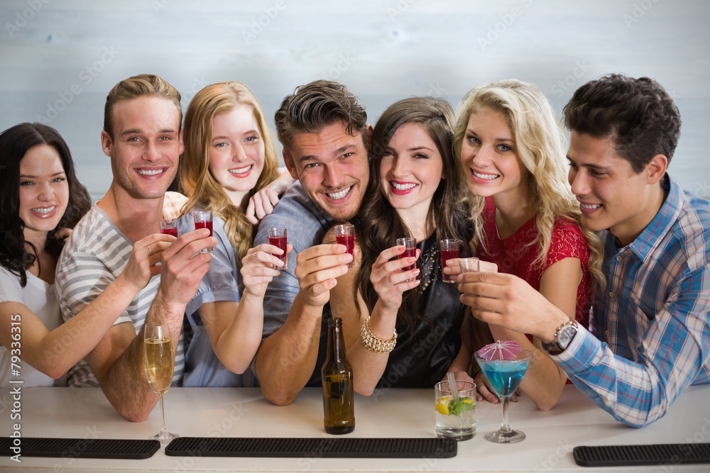 Composite image of friends with drinks Composite image of friends with drinks