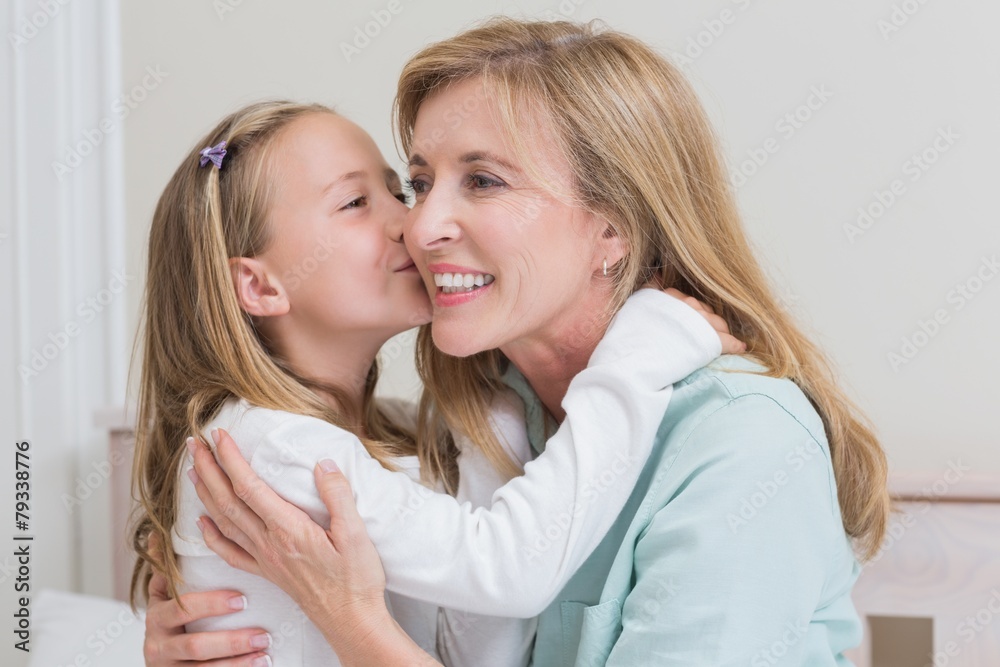 Cute little girl kissing her mother Cute little girl kissing her mother