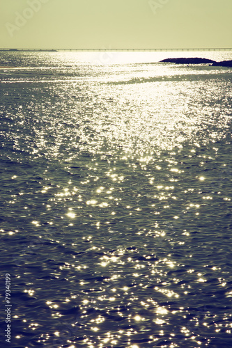 background of sunset and sea waves. filtered image photo