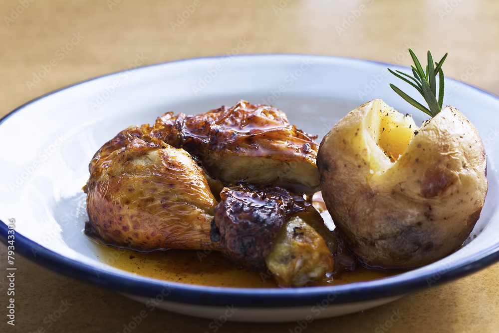 Roast chicken with potatoes on a plate Roast chicken with potatoes on a plate