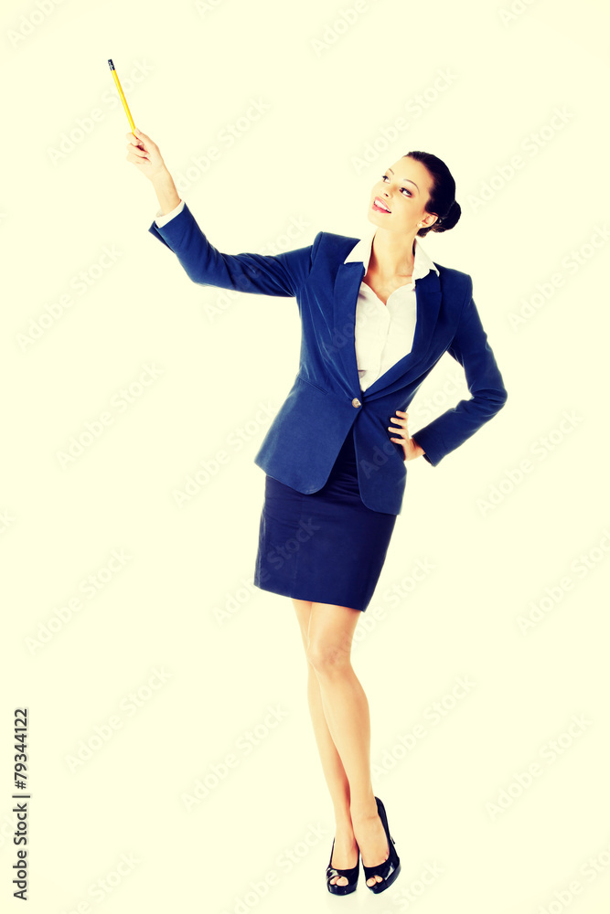 Attractive businesswoman pointing with pencil. Attractive businesswoman pointing with pencil.