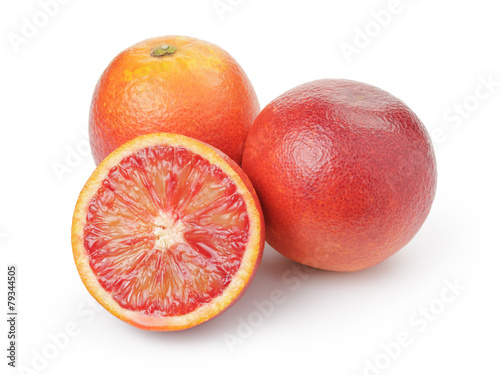 ripe blood red oranges with half isolated on white