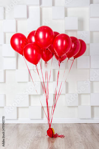 Red balloons in the room