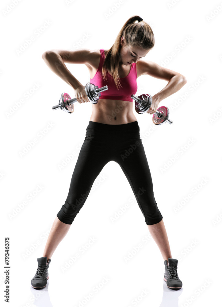 Fitness woman lifting dumbbells smiling cheerful