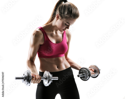 Fit girl with dumbbell