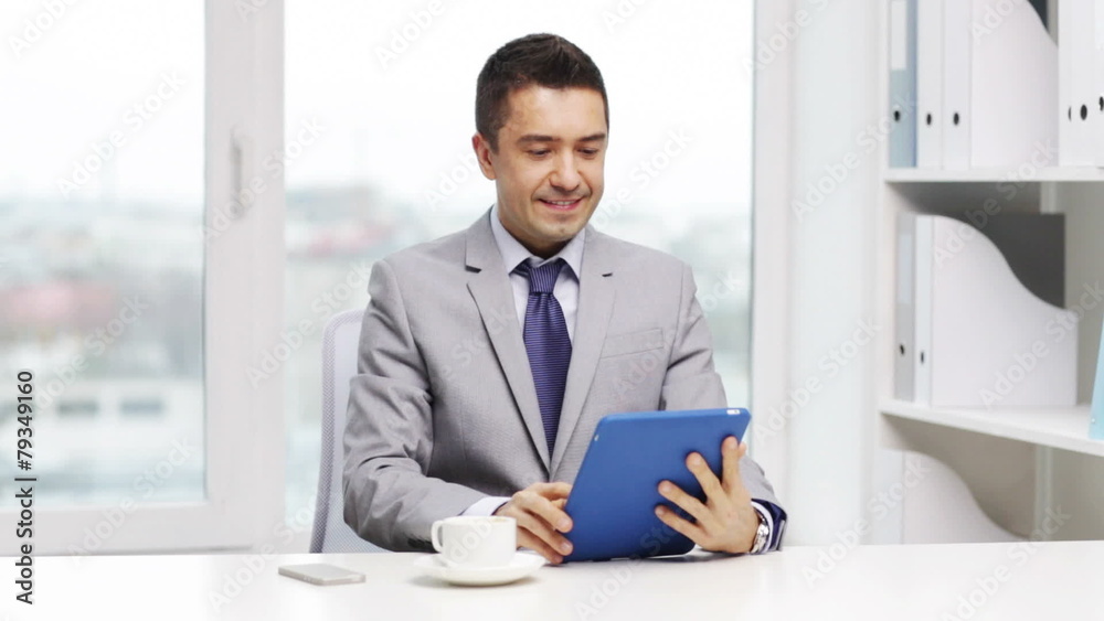 smiling businessman with tablet pc drinking coffee smiling businessman with tablet pc drinking coffee