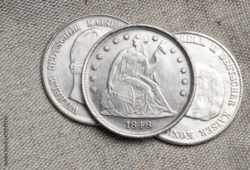 Old silver dollar coin over sack
