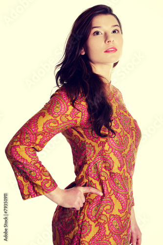Young woman in colorful dress.