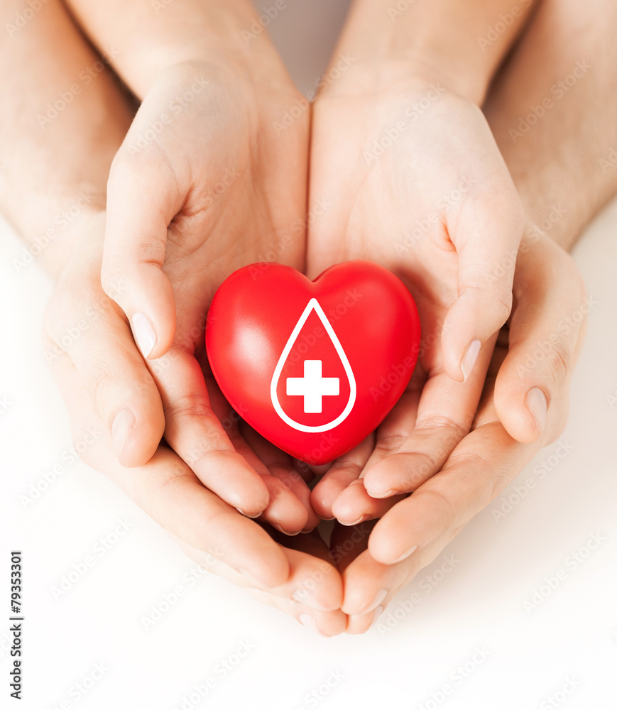 hands holding red heart with donor sign hands holding red heart with donor sign