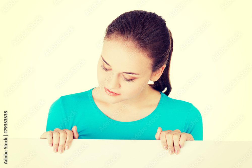Young happy woman with blank board. Young happy woman with blank board.