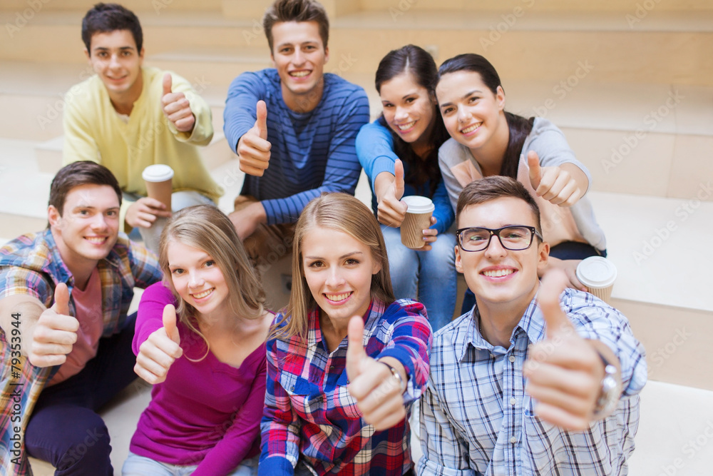 group of smiling students with paper coffee cups group of smiling students with paper coffee cups