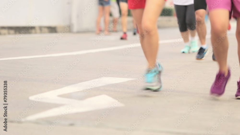 Marathon runners legs on the street Marathon runners legs on the street