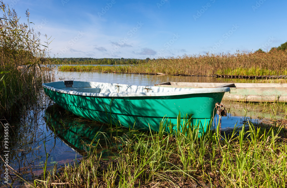 Fishing boats at the lake in summer day Fishing boats at the lake in summer day