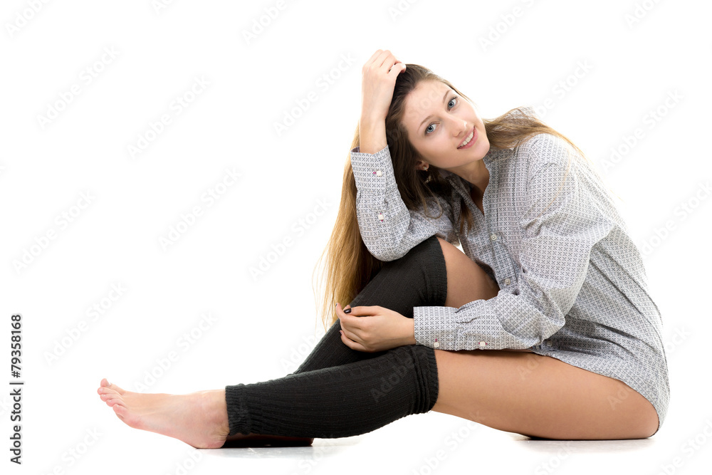 Smiling attractive young girl in shirt and gaiters