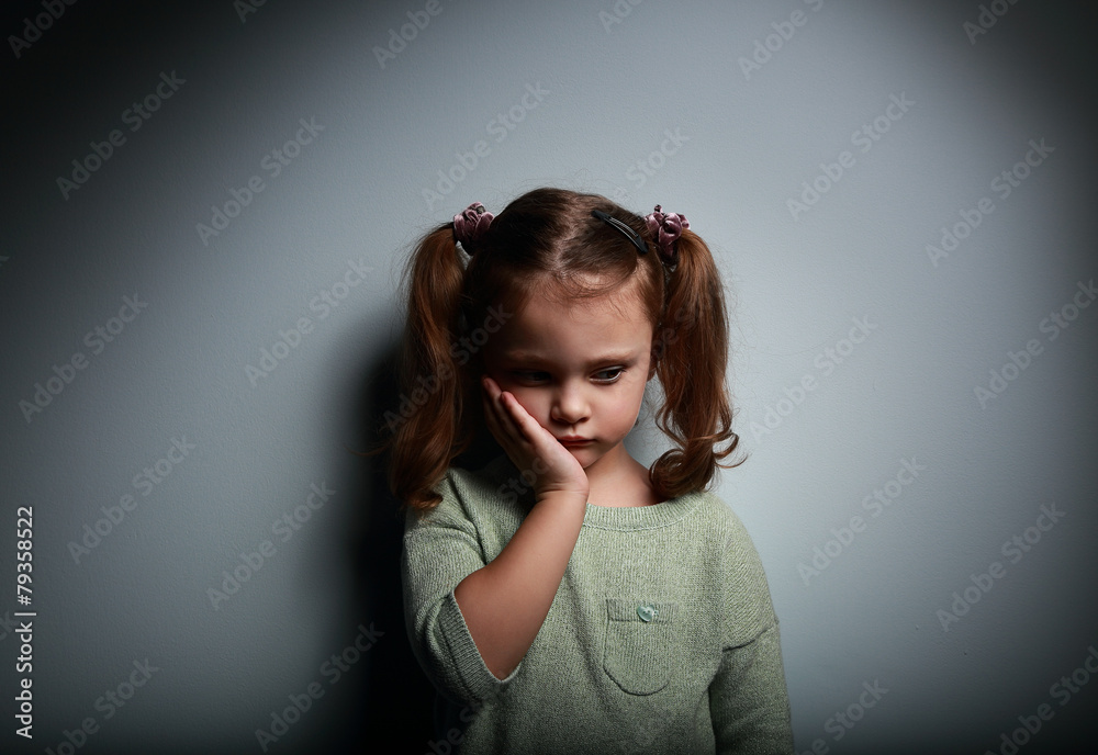 Sad alone kid girl thinking on dark. Problems at family Sad alone kid girl thinking on dark. Problems at family