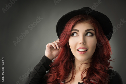 Happy young redhead with big toothy smile