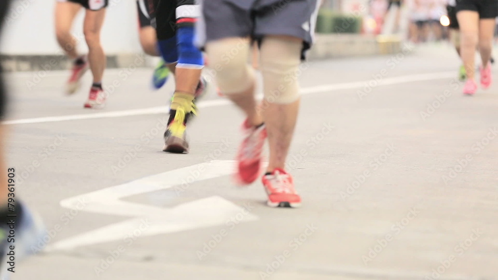 Marathon runners legs on the street Marathon runners legs on the street