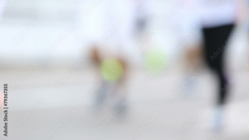 Defocused Marathon runners on the street Defocused Marathon runners on the street