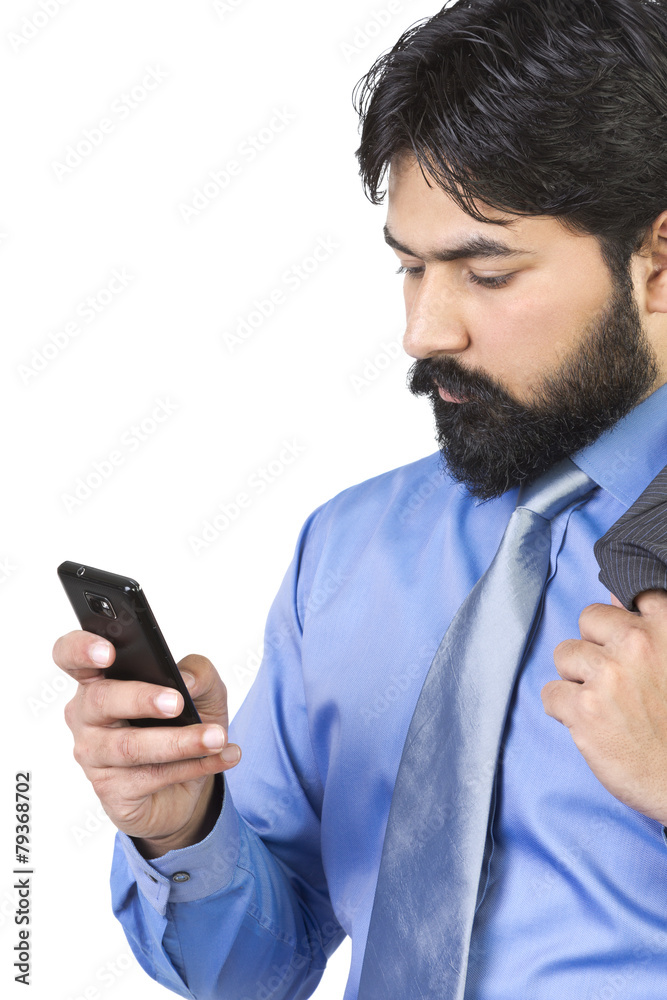 Indian businessman using cell phone Indian businessman using cell phone