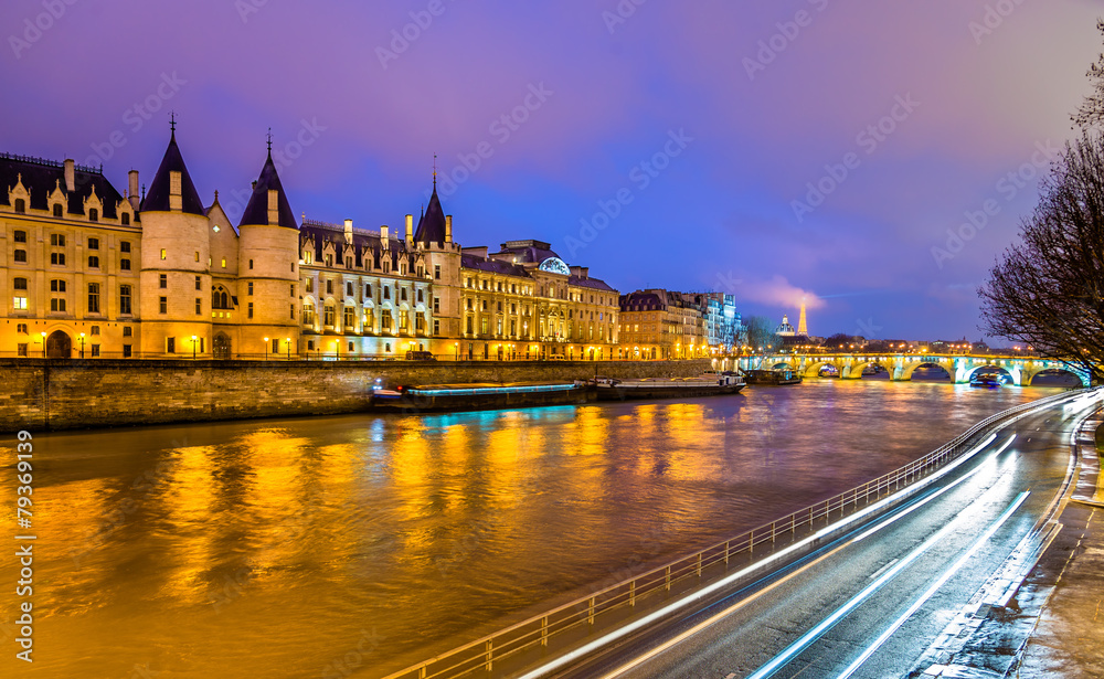The Conciergerie and the Seine river in Paris - France