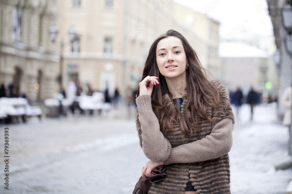 Young beautiful woman in stylish mink coat