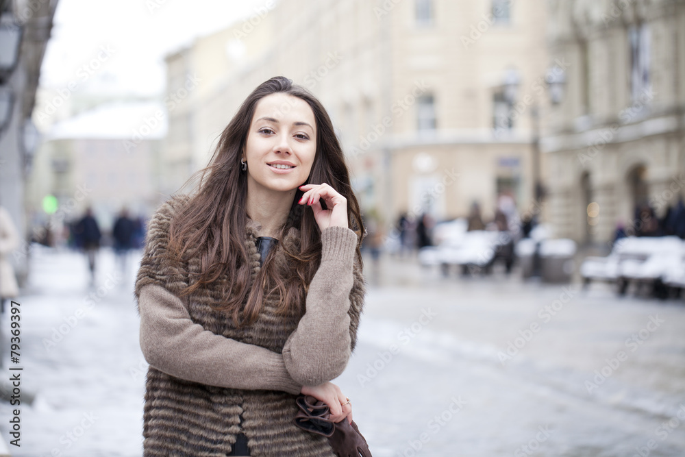 Fototapeta premium Young beautiful woman in stylish mink coat