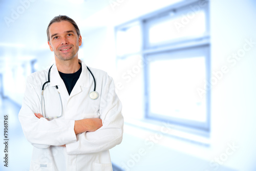 friendly young doctor with crossed arms