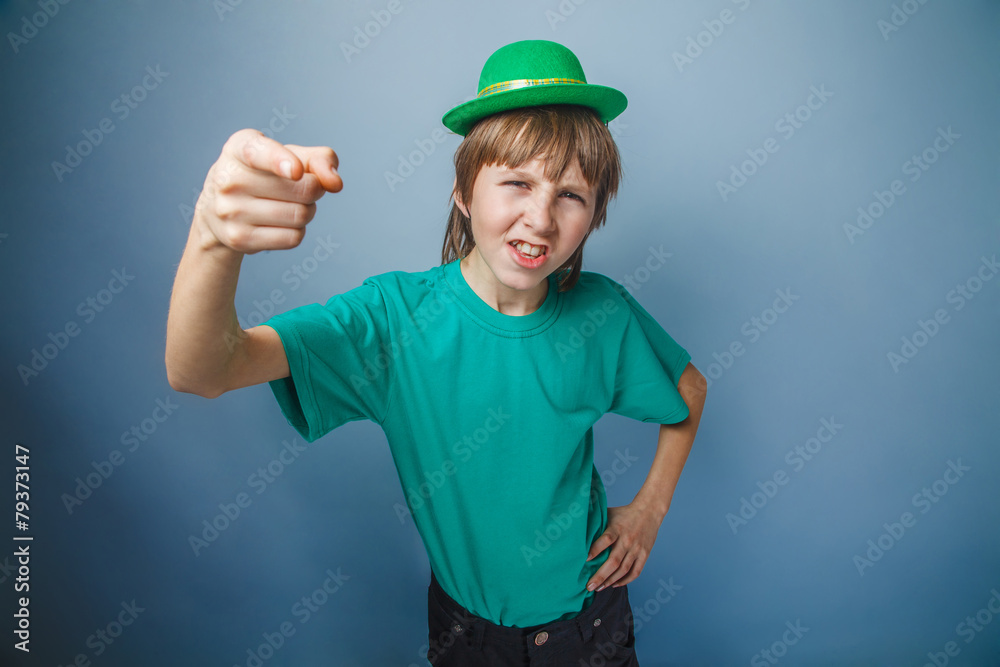 European-looking boy of ten years discontent is pointing at the European-looking boy of ten years discontent is pointing at the
