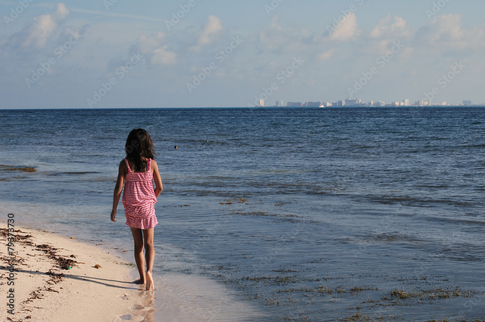 Girl walking at the beach