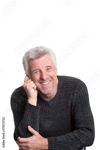 mature older man sitting smiling