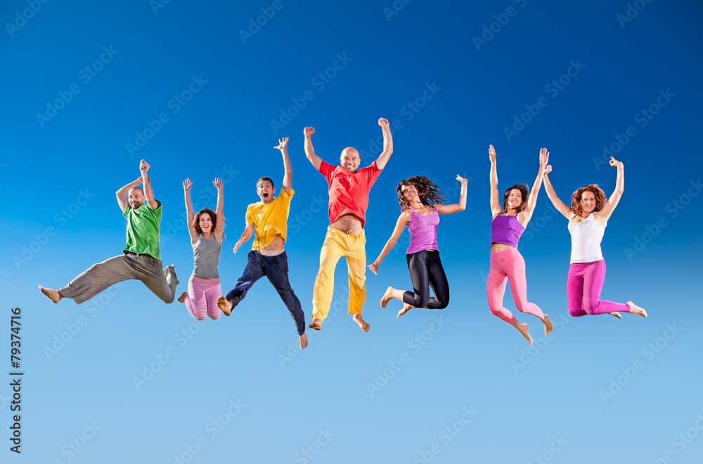 Happy smiling group of jumping over the blue sky. Happy smiling group of jumping over the blue sky.