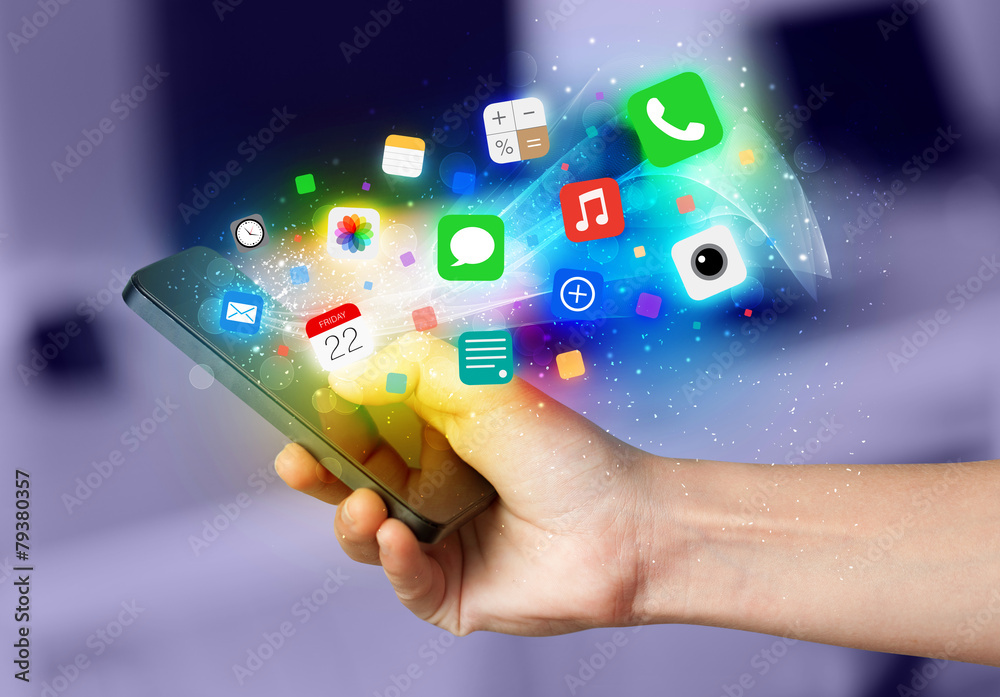 Hand holding smartphone with colorful app icons Hand holding smartphone with colorful app icons