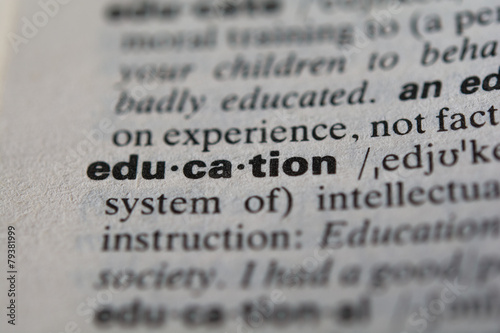 Definition of the word education, close up photo