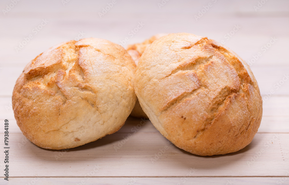 Tasty buns on wooden background