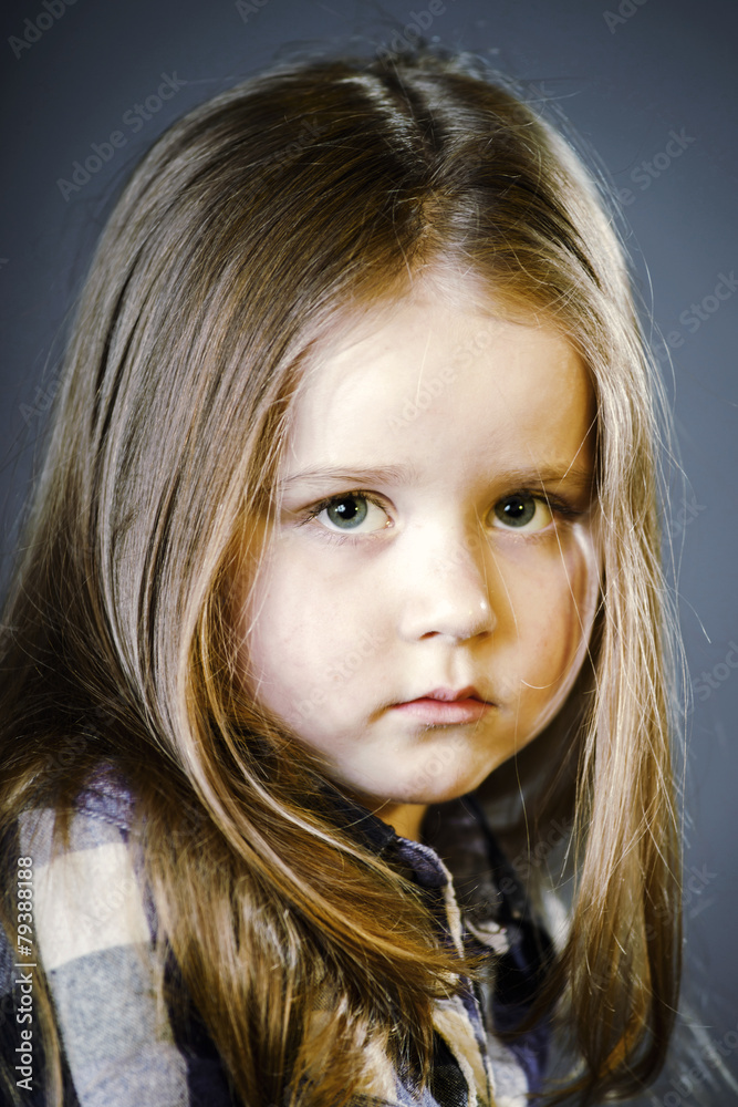 Naklejka premium Attractive little girl close-up portrait