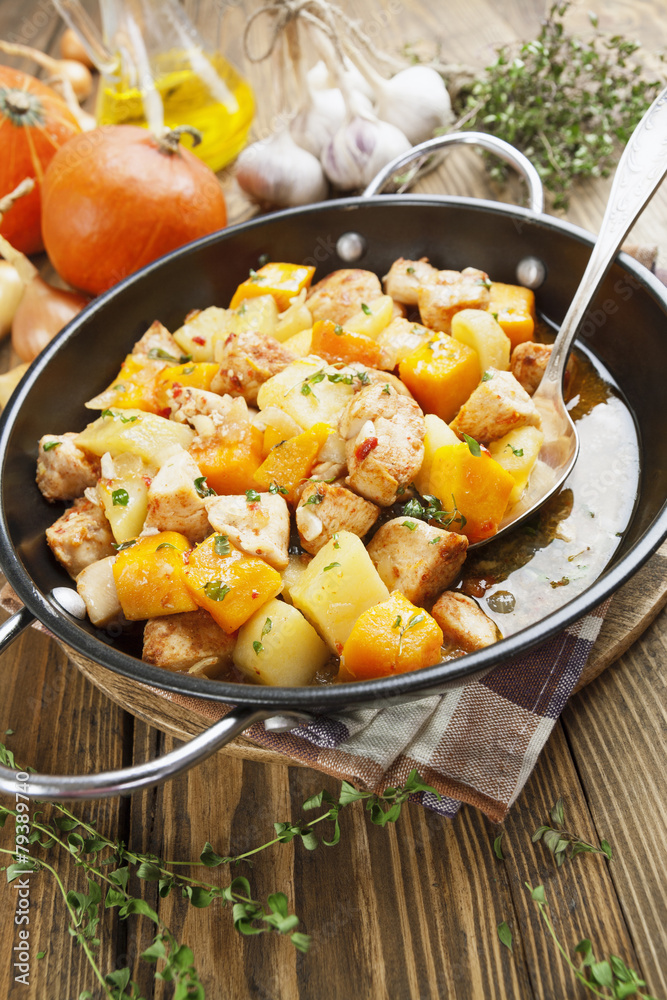 Chicken stew with pumpkin, potatoes and spices Chicken stew with pumpkin, potatoes and spices