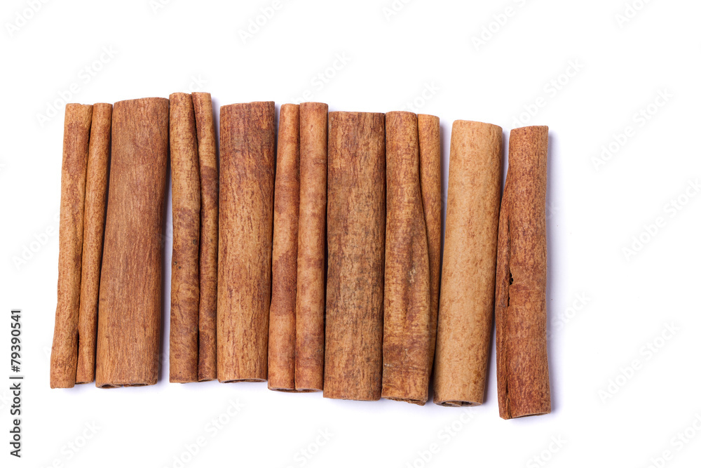 Top view row of aromatic cinnamon sticks. Top view row of aromatic cinnamon sticks.