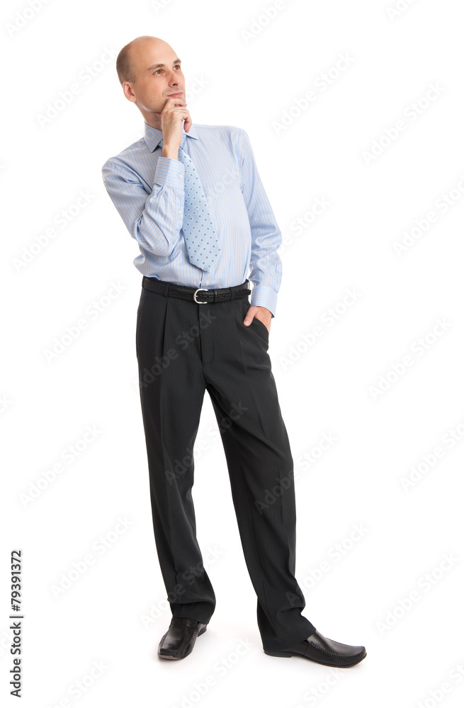 thoughtful bald businessman looking up