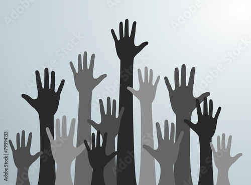 Various hands lifted up in the air. Many gray people's hands up