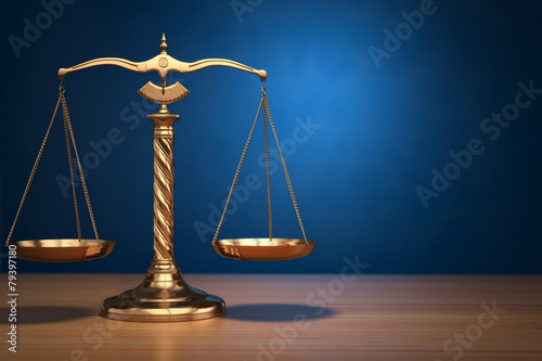 Concept of justice. Law scales on blue background.