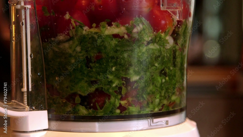 Making fresh salsa in blender with organic vegetables