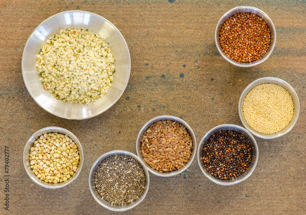 Collection of healthy grain in round metal containers Collection of healthy grain in round metal containers