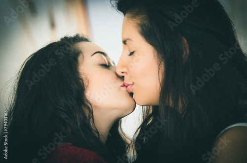 closeup portrait of cute lesbian couple in love