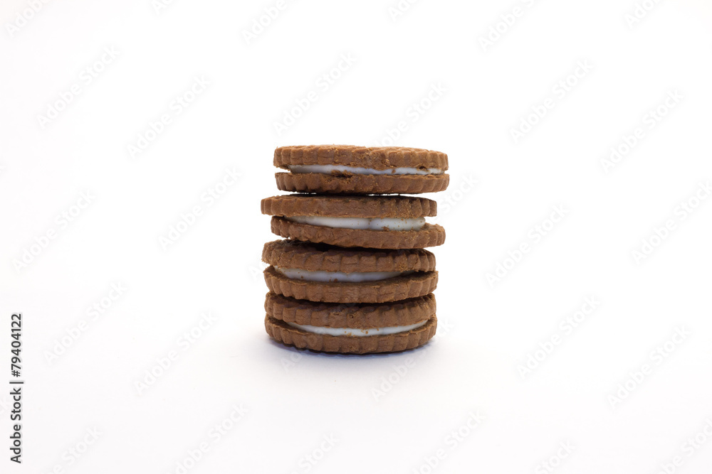 Four chocolate and vanilla cookies set in a pile Four chocolate and vanilla cookies set in a pile