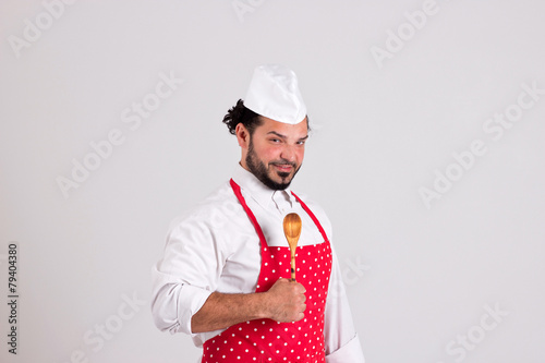 Handsome Chiefcook in Red Apron and Spoon photo